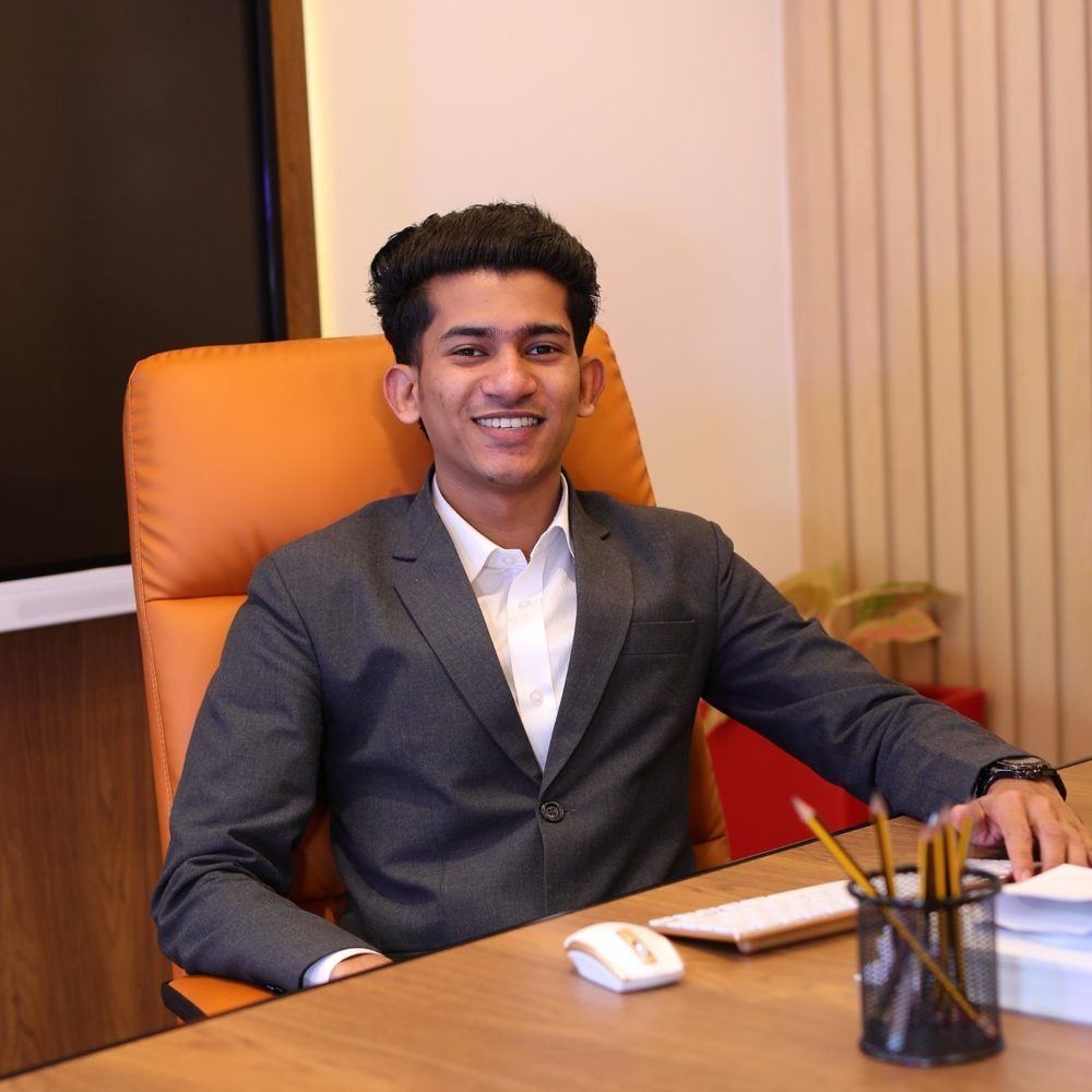 Muhamed Shaheer smiling at his desk